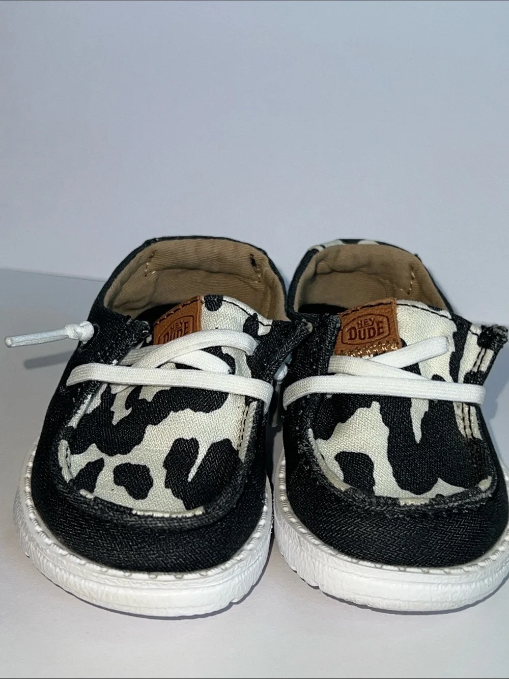 Hey Dude Wendy Black and White Cow Print Slip-On Loafers
